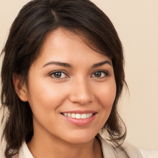 Joyful white young-adult female with medium  brown hair and brown eyes