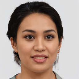 Joyful white young-adult female with medium  brown hair and brown eyes