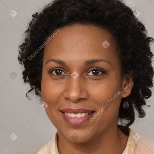 Joyful black adult female with medium  brown hair and brown eyes