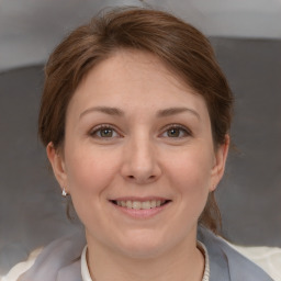 Joyful white adult female with short  brown hair and brown eyes