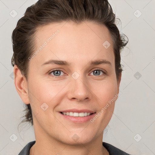 Joyful white young-adult female with short  brown hair and grey eyes