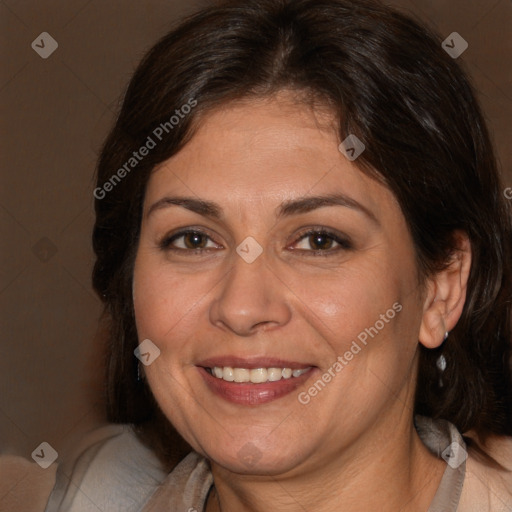 Joyful white adult female with long  brown hair and brown eyes