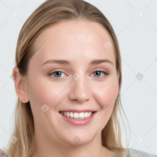 Joyful white young-adult female with long  brown hair and blue eyes