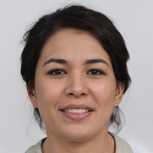 Joyful asian young-adult female with medium  brown hair and brown eyes