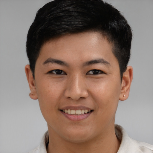 Joyful asian young-adult male with short  brown hair and brown eyes