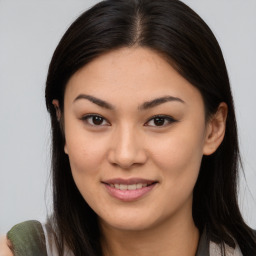 Joyful asian young-adult female with long  brown hair and brown eyes