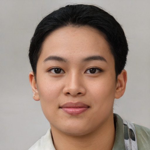 Joyful asian young-adult female with short  black hair and brown eyes