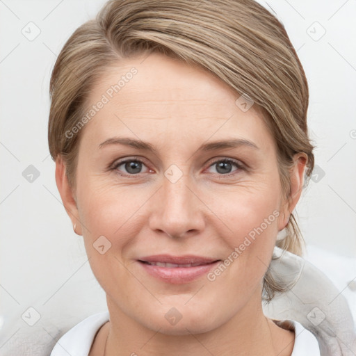 Joyful white adult female with medium  brown hair and grey eyes