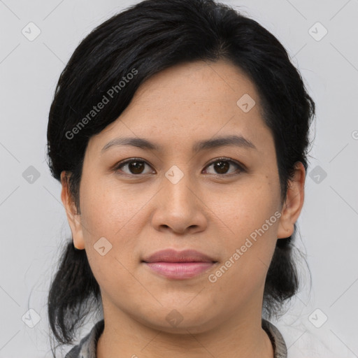 Joyful asian young-adult female with medium  brown hair and brown eyes