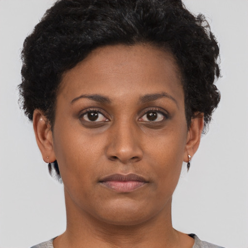 Neutral black young-adult female with short  brown hair and brown eyes