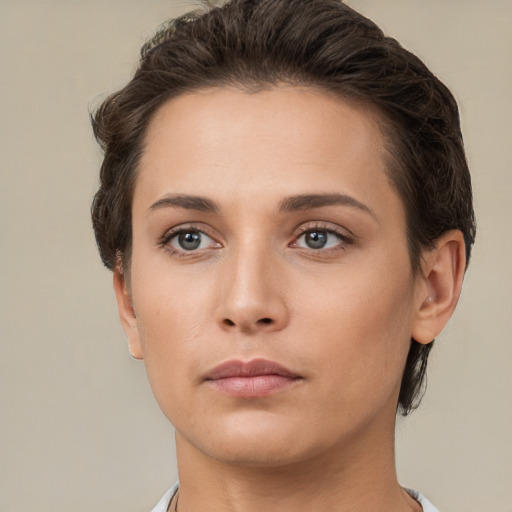 Neutral white young-adult female with short  brown hair and brown eyes