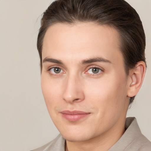 Joyful white young-adult male with medium  brown hair and brown eyes