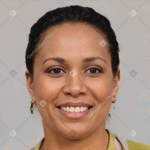 Joyful latino young-adult female with short  black hair and brown eyes