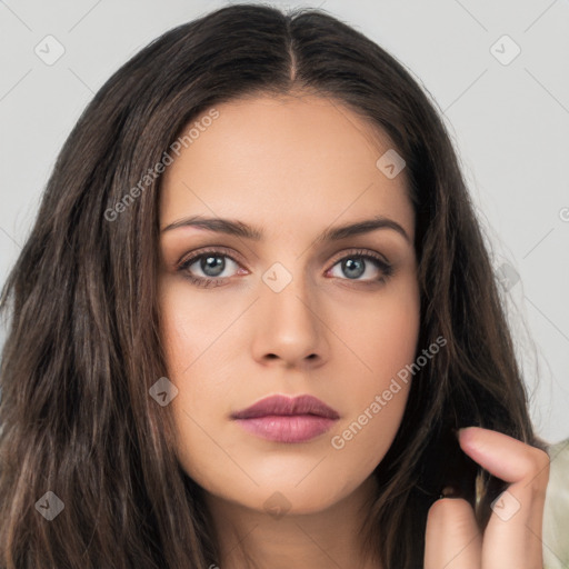 Neutral white young-adult female with long  brown hair and brown eyes