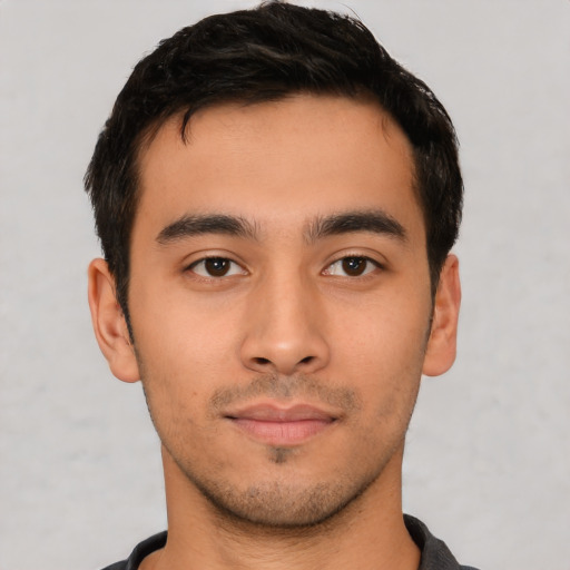 Neutral latino young-adult male with short  black hair and brown eyes
