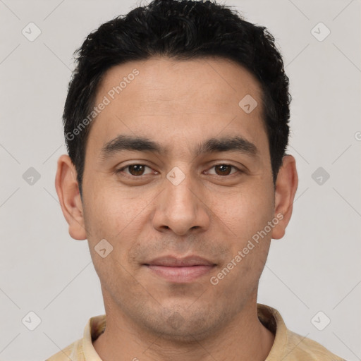 Joyful white young-adult male with short  black hair and brown eyes