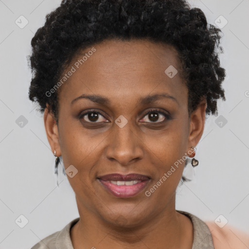 Joyful black adult female with short  brown hair and brown eyes