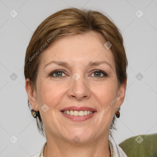 Joyful white adult female with medium  brown hair and grey eyes