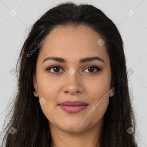 Joyful latino young-adult female with long  brown hair and brown eyes