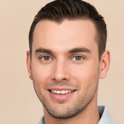 Joyful white young-adult male with short  brown hair and brown eyes