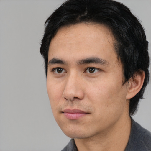 Neutral asian young-adult male with short  black hair and brown eyes