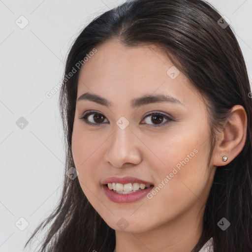 Joyful white young-adult female with long  brown hair and brown eyes