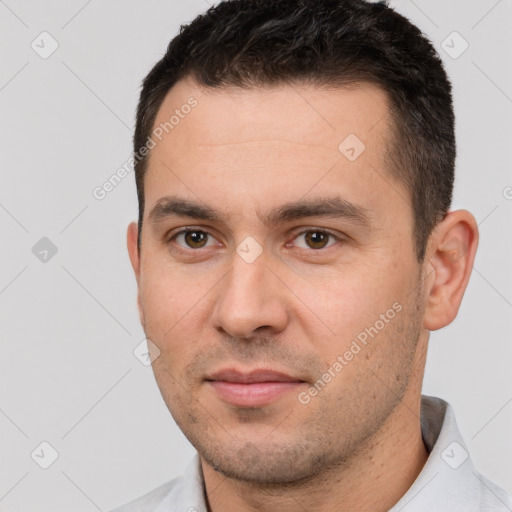 Joyful white young-adult male with short  brown hair and brown eyes