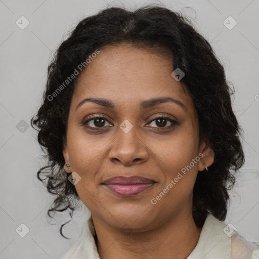 Joyful black adult female with medium  brown hair and brown eyes