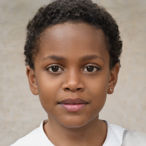 Joyful black child female with short  brown hair and brown eyes