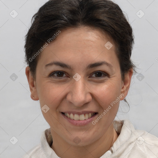 Joyful white adult female with short  brown hair and brown eyes