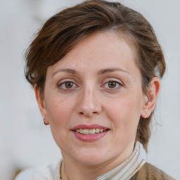 Joyful white adult female with medium  brown hair and grey eyes