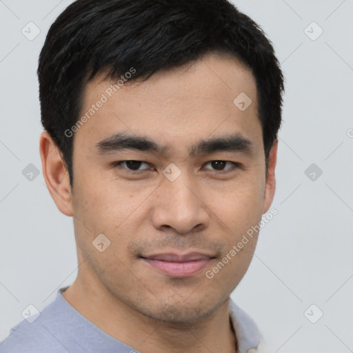 Joyful asian young-adult male with short  black hair and brown eyes