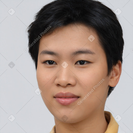 Joyful asian young-adult female with short  black hair and brown eyes