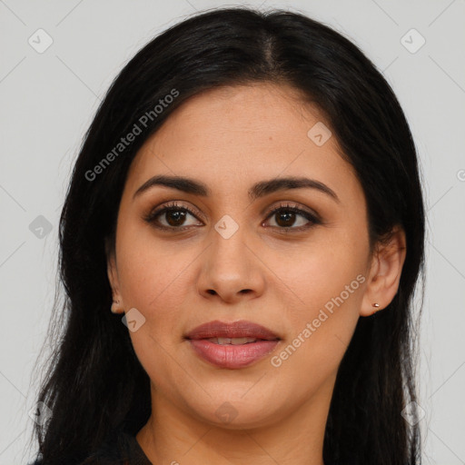 Joyful latino young-adult female with long  black hair and brown eyes