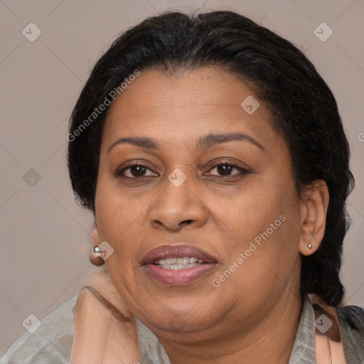 Joyful latino adult female with medium  brown hair and brown eyes