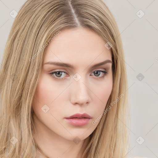 Neutral white young-adult female with long  brown hair and brown eyes