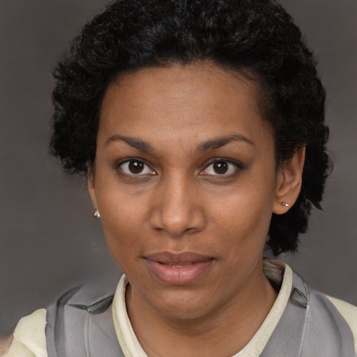 Neutral black adult female with short  black hair and brown eyes