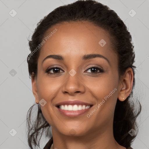 Joyful latino young-adult female with long  brown hair and brown eyes