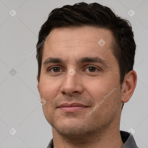 Joyful white adult male with short  brown hair and brown eyes