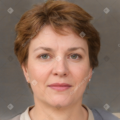 Joyful white adult female with short  brown hair and grey eyes