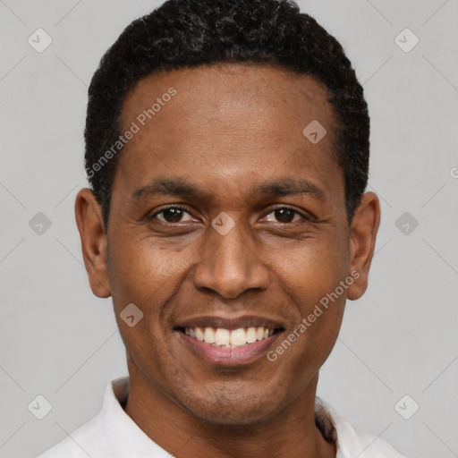 Joyful latino adult male with short  black hair and brown eyes