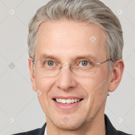 Joyful white middle-aged male with short  brown hair and grey eyes