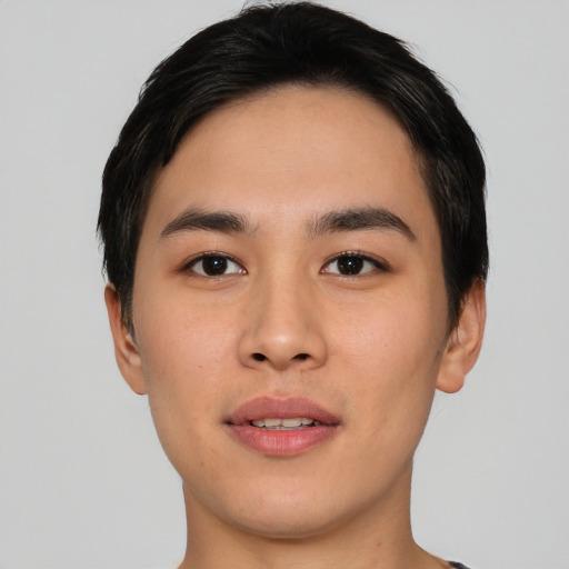 Joyful asian young-adult male with short  black hair and brown eyes