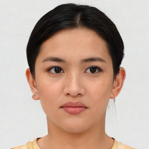 Neutral white young-adult female with short  black hair and brown eyes