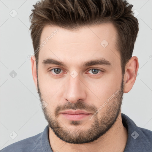 Neutral white young-adult male with short  brown hair and brown eyes