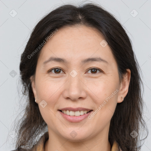 Joyful white adult female with medium  brown hair and brown eyes