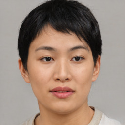 Joyful asian young-adult female with short  brown hair and brown eyes