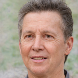 Joyful white middle-aged male with short  brown hair and brown eyes