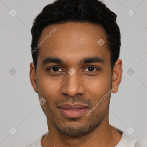 Joyful black young-adult male with short  black hair and brown eyes