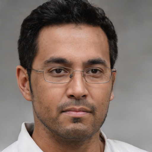 Neutral asian adult male with short  brown hair and brown eyes